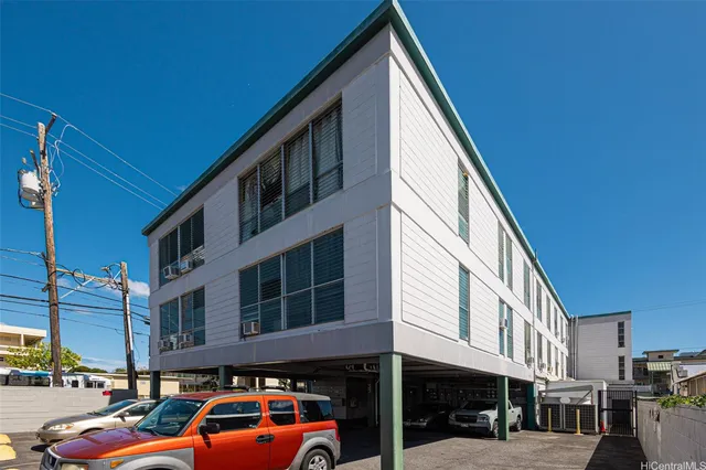 a view of a car park in front of a building