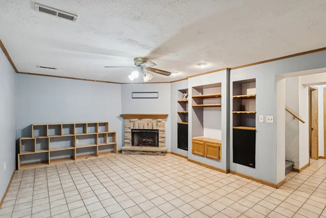 a view of a kitchen with a sink and a refrigerator