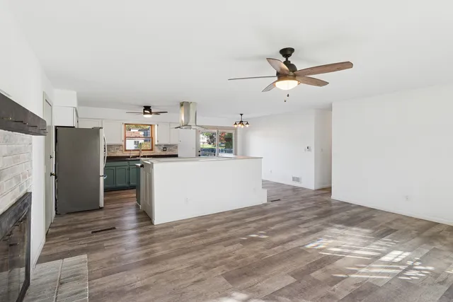 a kitchen with stainless steel appliances granite countertop a stove and a sink