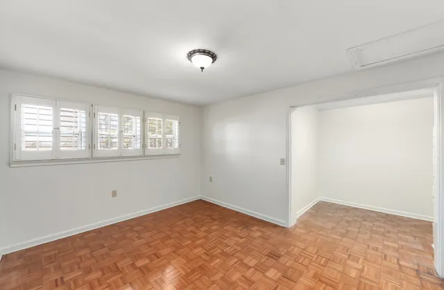 a view of an empty room with a window