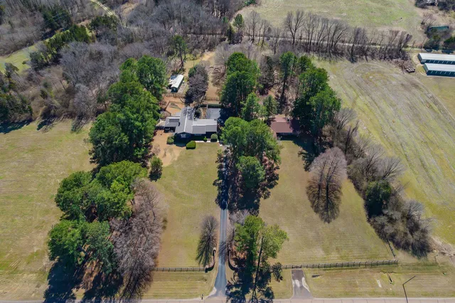 an aerial view of residential house with outdoor space