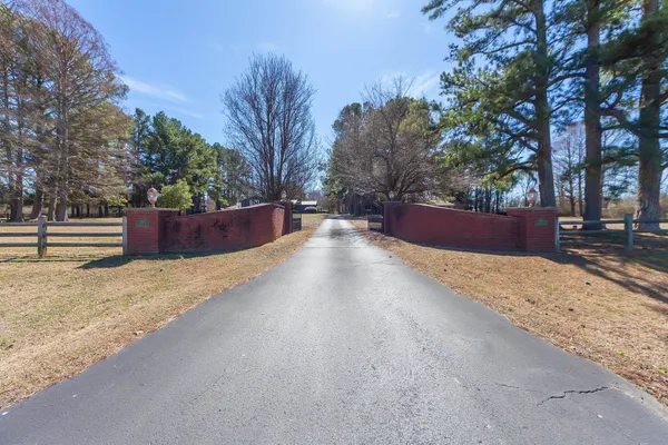 a view of wooden fence next to a road