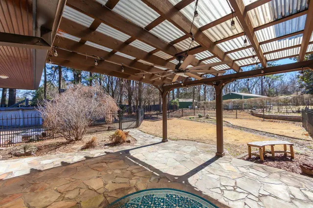 a building outdoor space with patio furniture and wooden floor