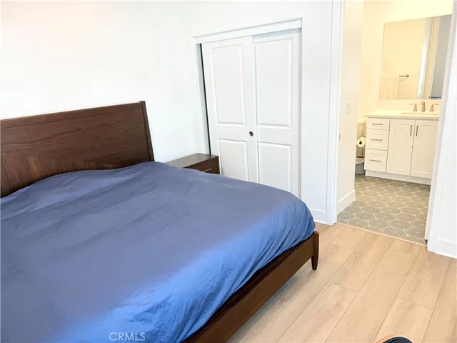 a bedroom with a bed and a table