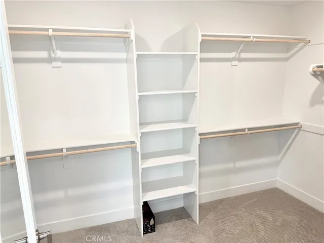 a view of an empty walk in closet