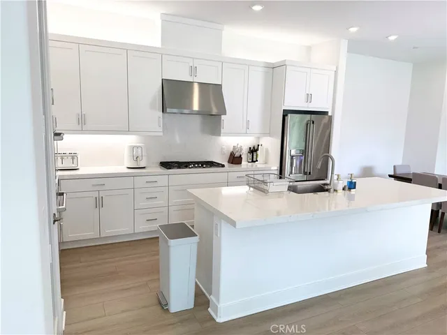 a kitchen with a sink cabinets and appliances