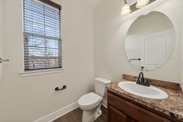 a view of a room with wooden floor and small space