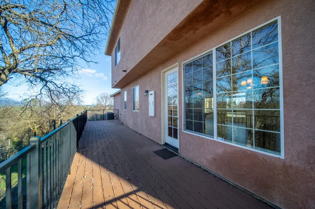 a view of balcony with wooden floor