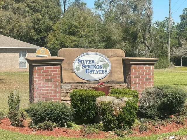 a sign that is on a wooden fence