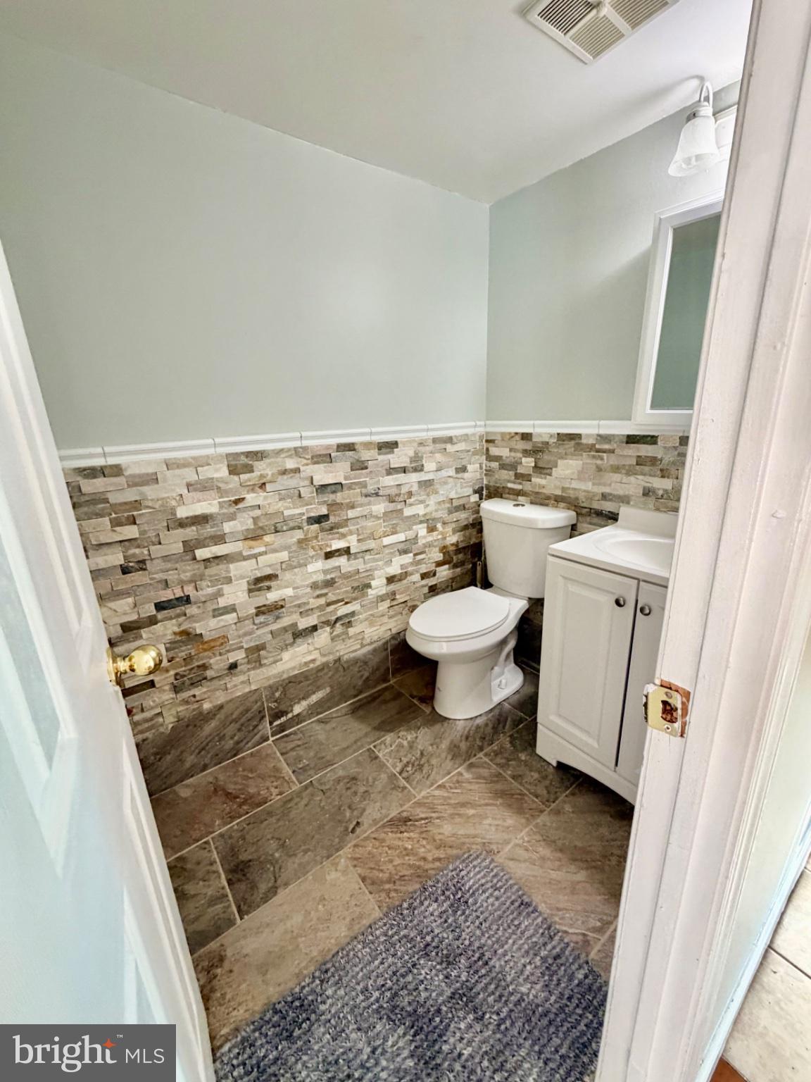 2091 Red Lion Road, Unit A Philadelphia, PA 19116 - Photo 3 of 5 a bathroom with a toilet sink and mirror