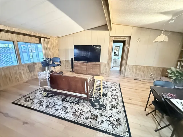 a living room with a couch and a flat screen tv