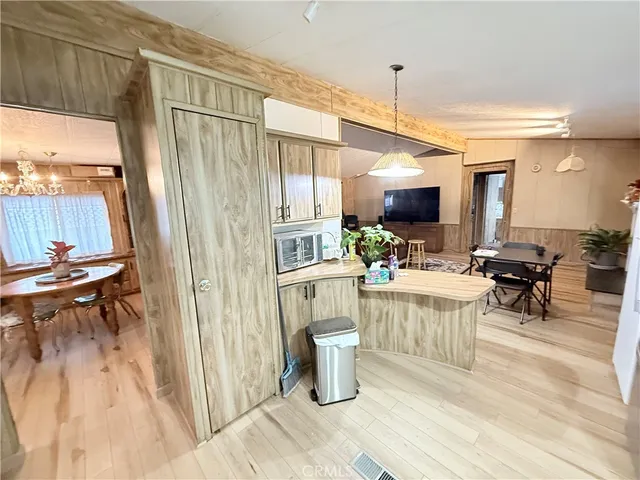 a dining table chair next to a window