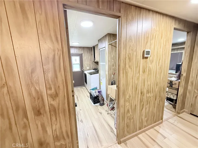 a bathroom with a tub a sink and a mirror