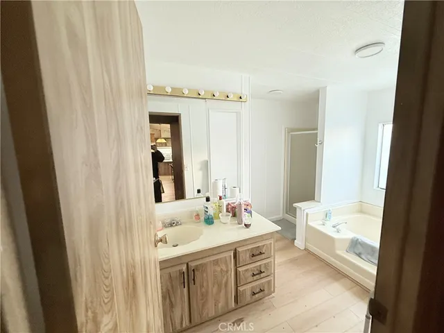 a bathroom with a tub and a window