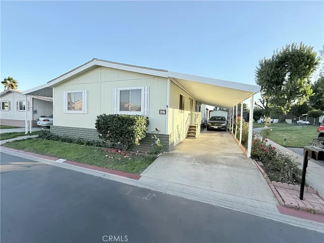 a view of a house with a yard and garage