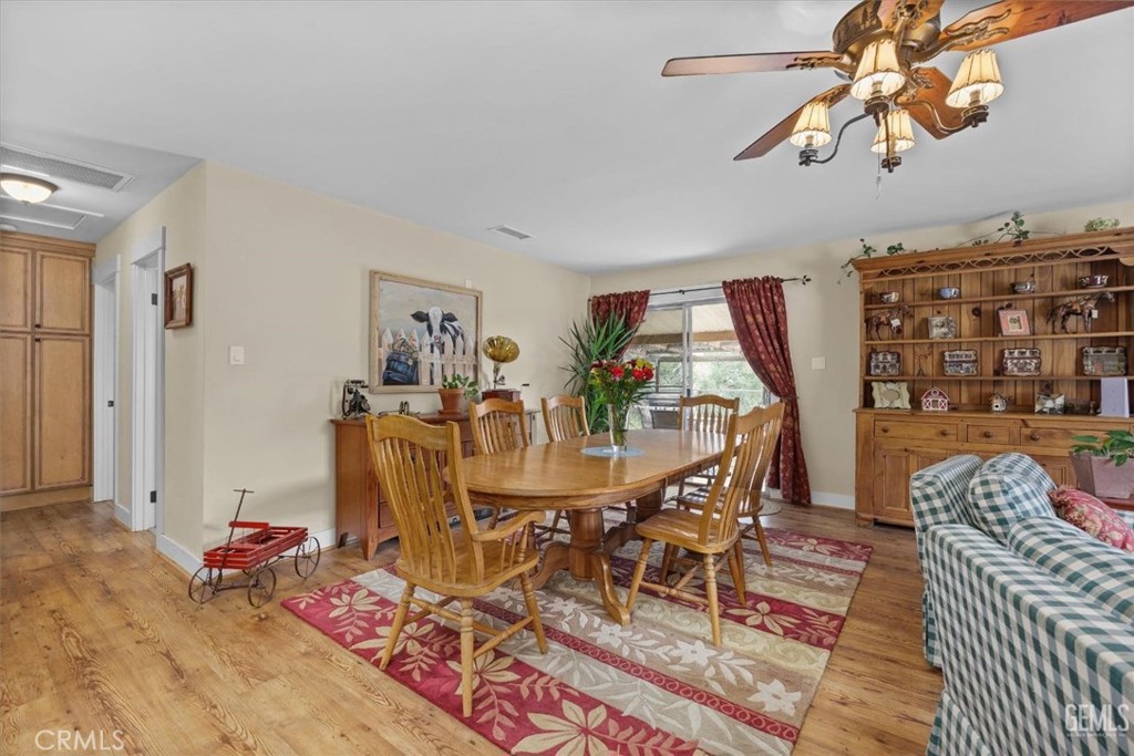 21564 Pine Tree Road Caliente, CA 93518 - Photo 21 of 48 a view of a dining room with furniture and wooden floor