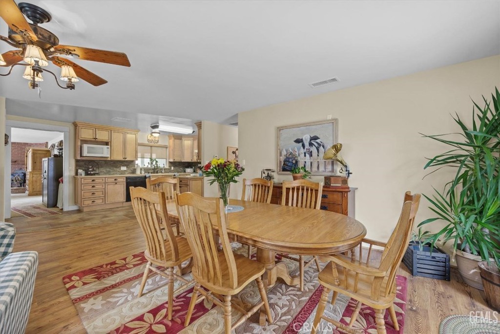 21564 Pine Tree Road Caliente, CA 93518 - Photo 22 of 48 a view of a dining room with furniture and wooden floor