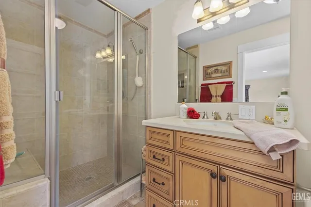 a spacious bedroom with a large bed and a large window