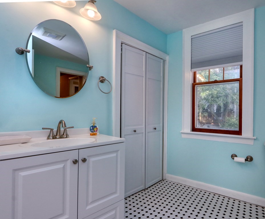 4 Pleasant Street Boston, MA 02129 - Photo 11 of 31 a bathroom with a sink and a mirror