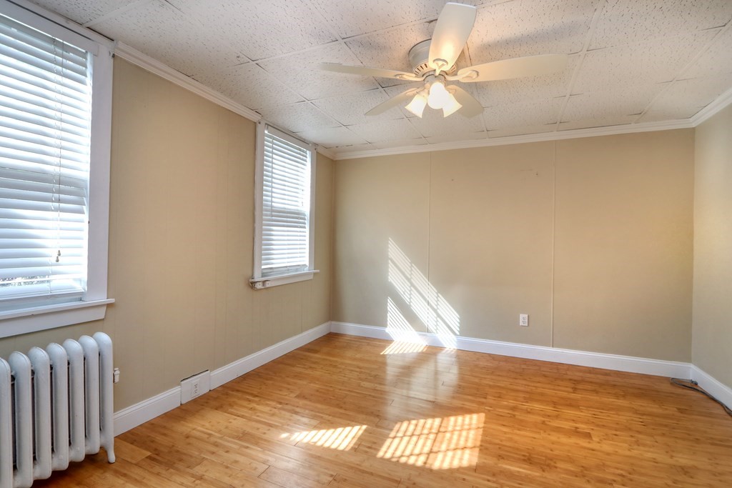 4 Pleasant Street Boston, MA 02129 - Photo 13 of 31 a view of empty room with wooden floor and fan