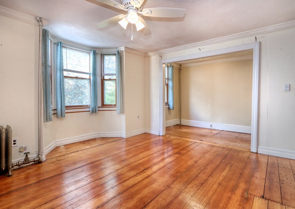 4 Pleasant Street Boston, MA 02129 - Photo 16 of 31 an empty room with wooden floor fan and windows