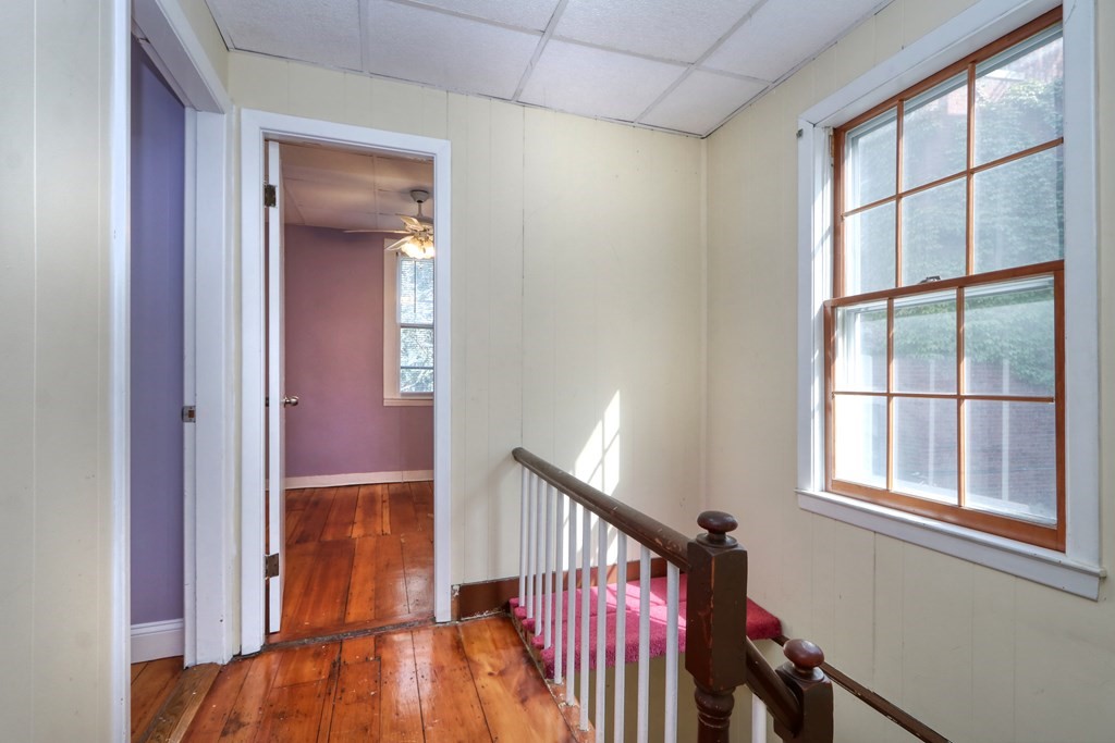 4 Pleasant Street Boston, MA 02129 - Photo 18 of 31 wooden floor in an empty room with a window