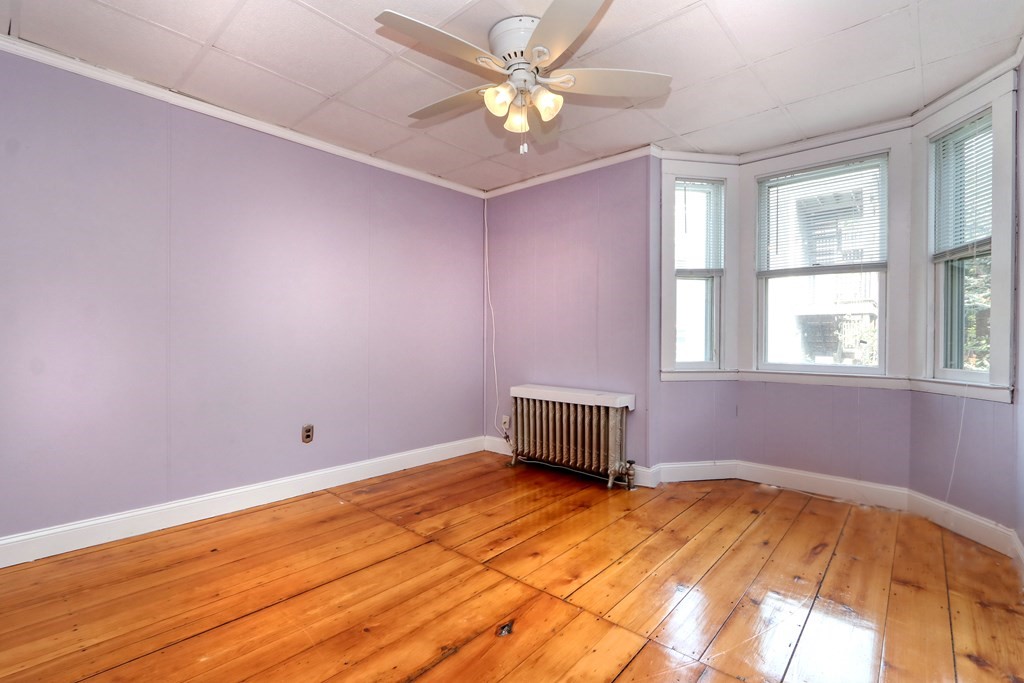 4 Pleasant Street Boston, MA 02129 - Photo 20 of 31 a view of a livingroom with a window and a ceiling fan