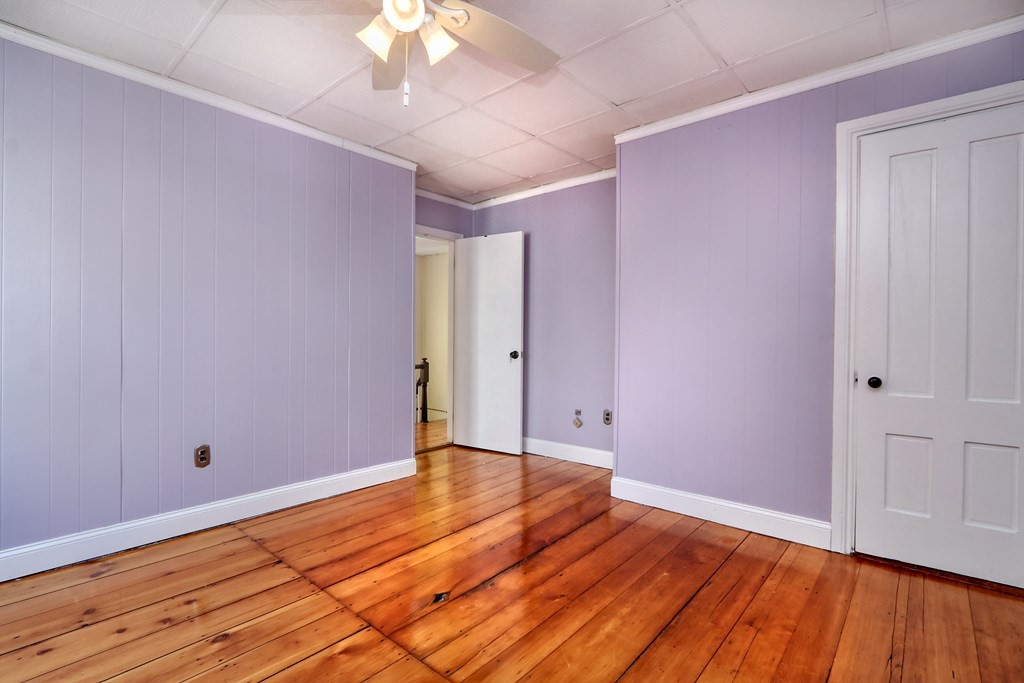 4 Pleasant Street Boston, MA 02129 - Photo 21 of 31 a view of an empty room with wooden floor