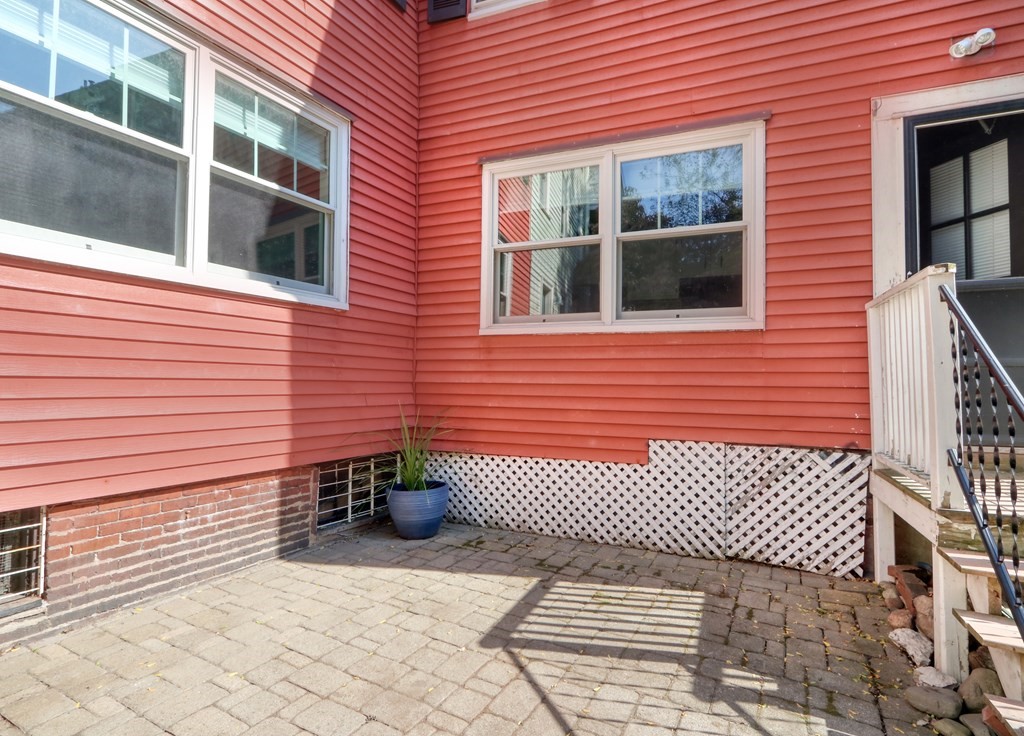4 Pleasant Street Boston, MA 02129 - Photo 25 of 31 a view of a brick wall with a large window