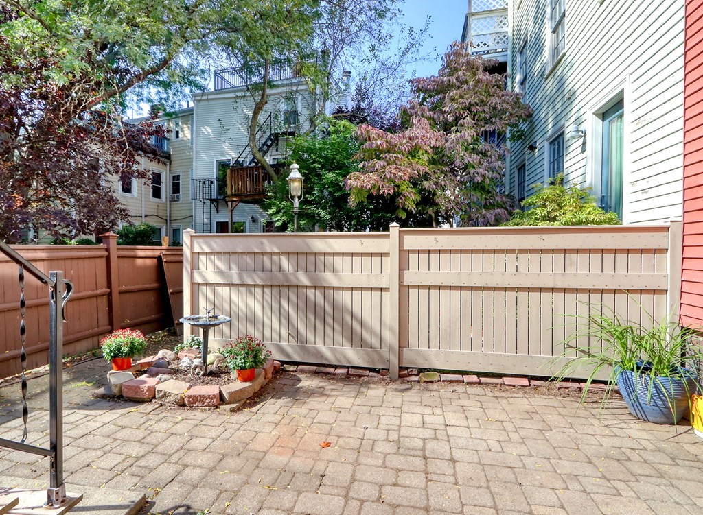 4 Pleasant Street Boston, MA 02129 - Photo 26 of 31 a view of a chair and table in the backyard