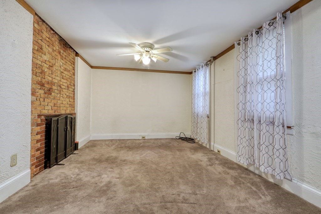 4 Pleasant Street Boston, MA 02129 - Photo 5 of 31 a view of an empty room with a fireplace