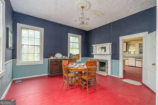 a kitchen with stainless steel appliances granite countertop a sink and cabinets with wooden floor