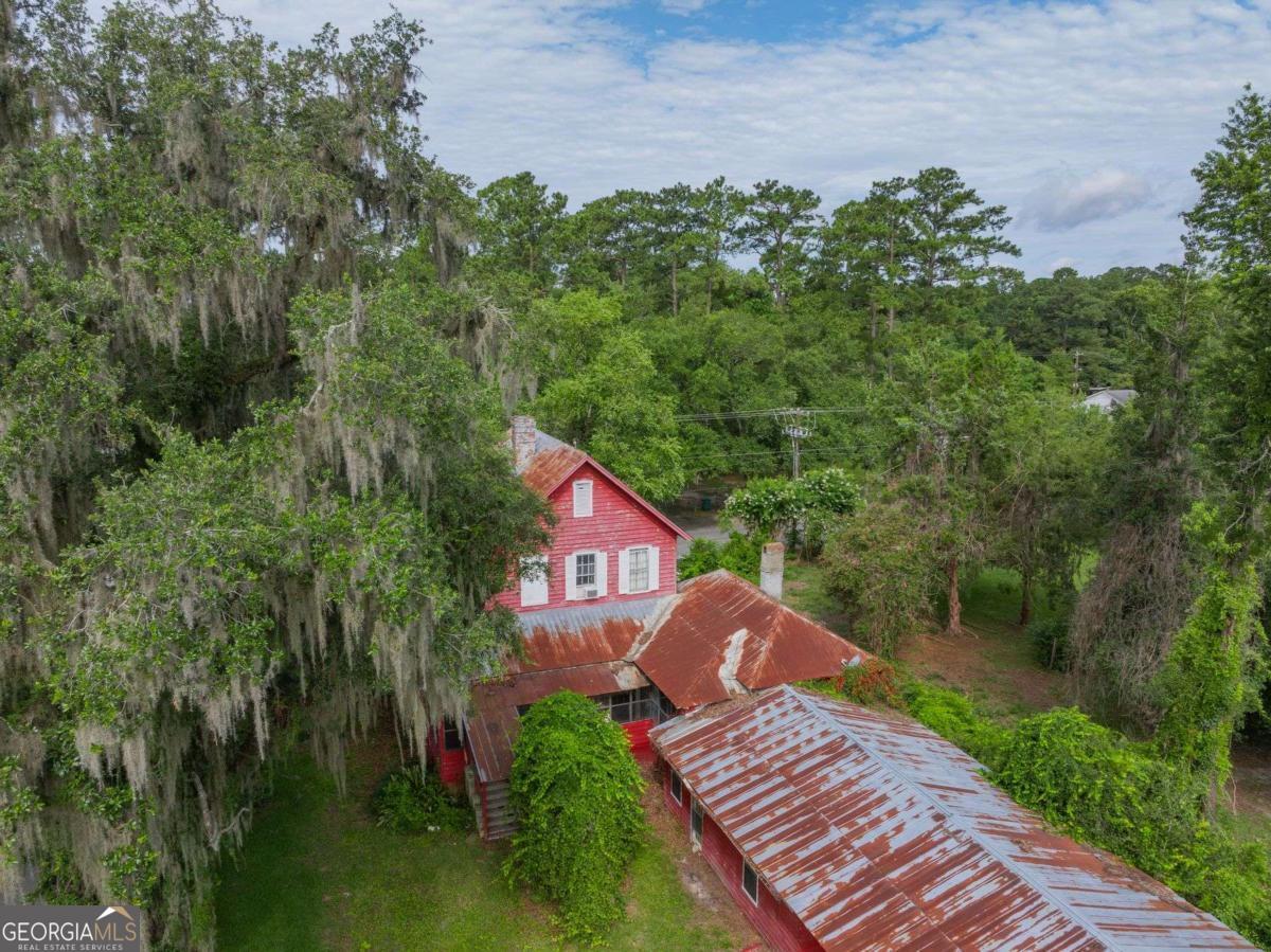 602 Magnolia Street Guyton, GA 31312 - Photo 32 of 34 a view of a house with a yard