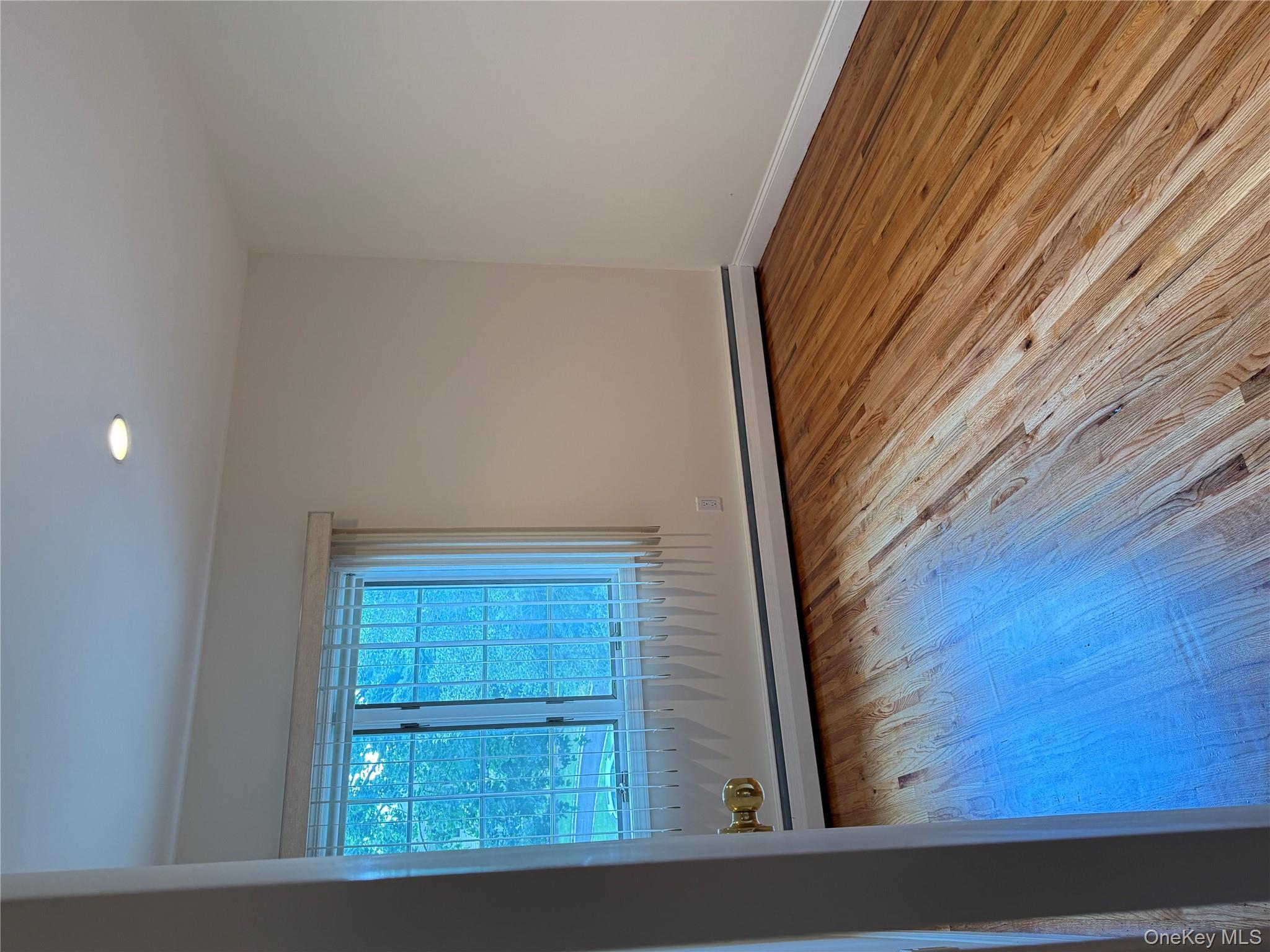30 Dogwood Road, Unit PVT HOUSE Albertson, NY 11507 - Photo 9 of 15 an empty room with wooden floor and windows