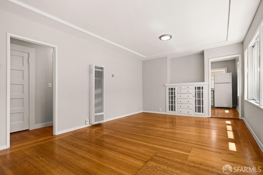 3111 Wheeler Street Berkeley, CA 94705 - Photo 15 of 44 a bedroom with a bed and wooden floor