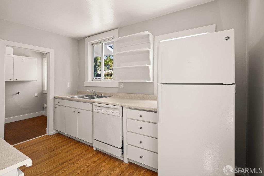 3111 Wheeler Street Berkeley, CA 94705 - Photo 19 of 44 a kitchen with a refrigerator and a sink