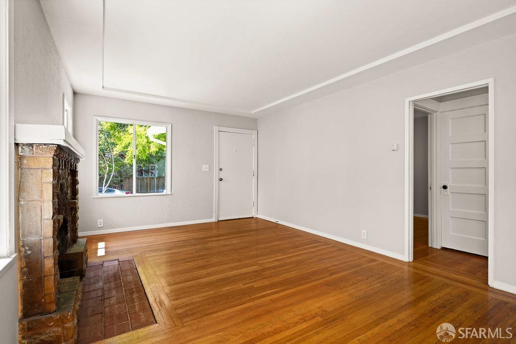 3111 Wheeler Street Berkeley, CA 94705 - Photo 9 of 44 a view of an empty room with wooden floor and a window