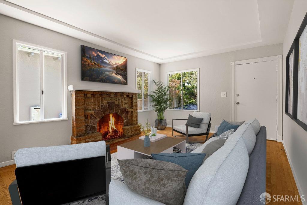 3111 Wheeler Street Berkeley, CA 94705 - Photo 10 of 44 a living room with furniture and a fireplace