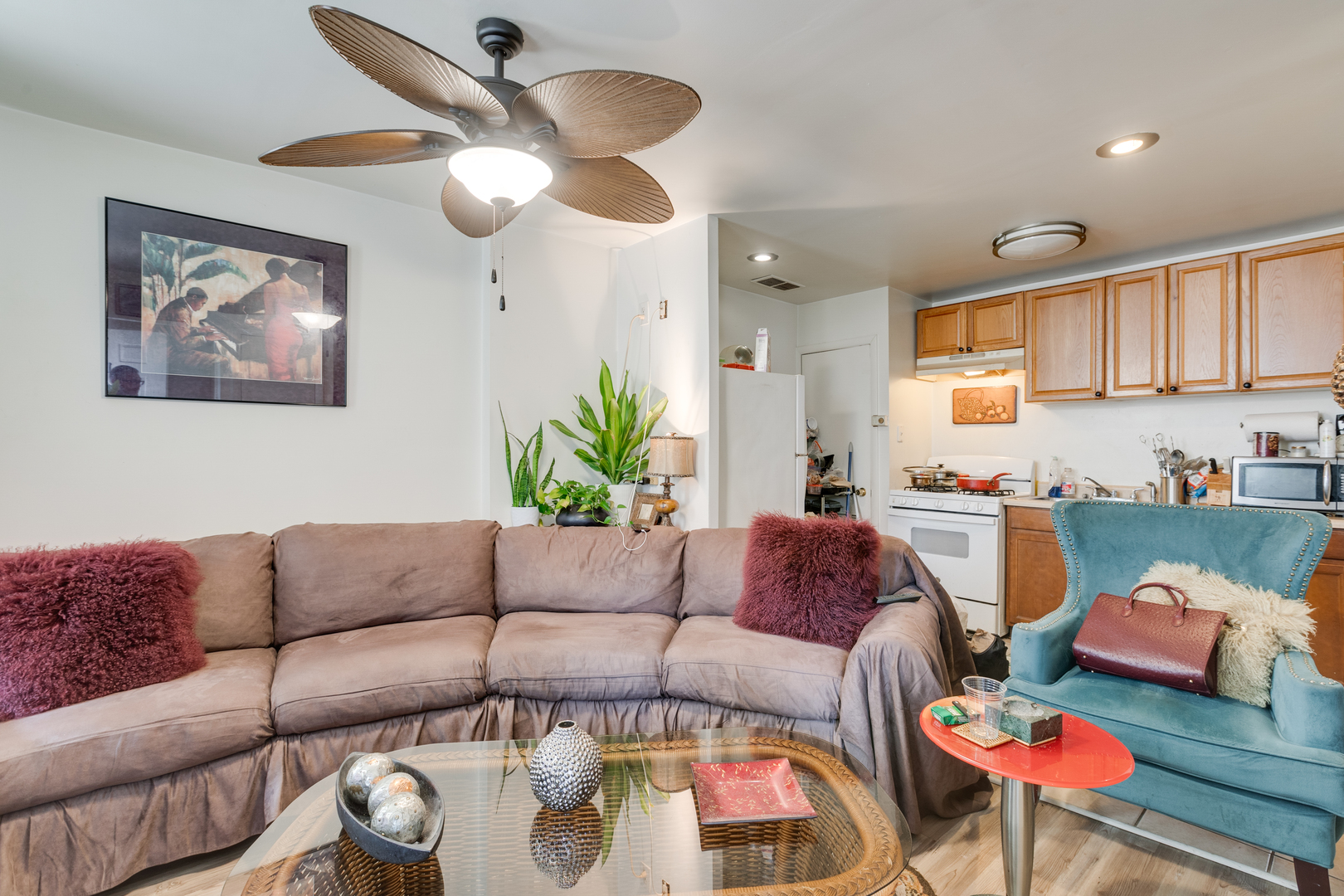 1005 South Racine Avenue Chicago, IL 60607 - Photo 12 of 16 a living room with furniture and a kitchen
