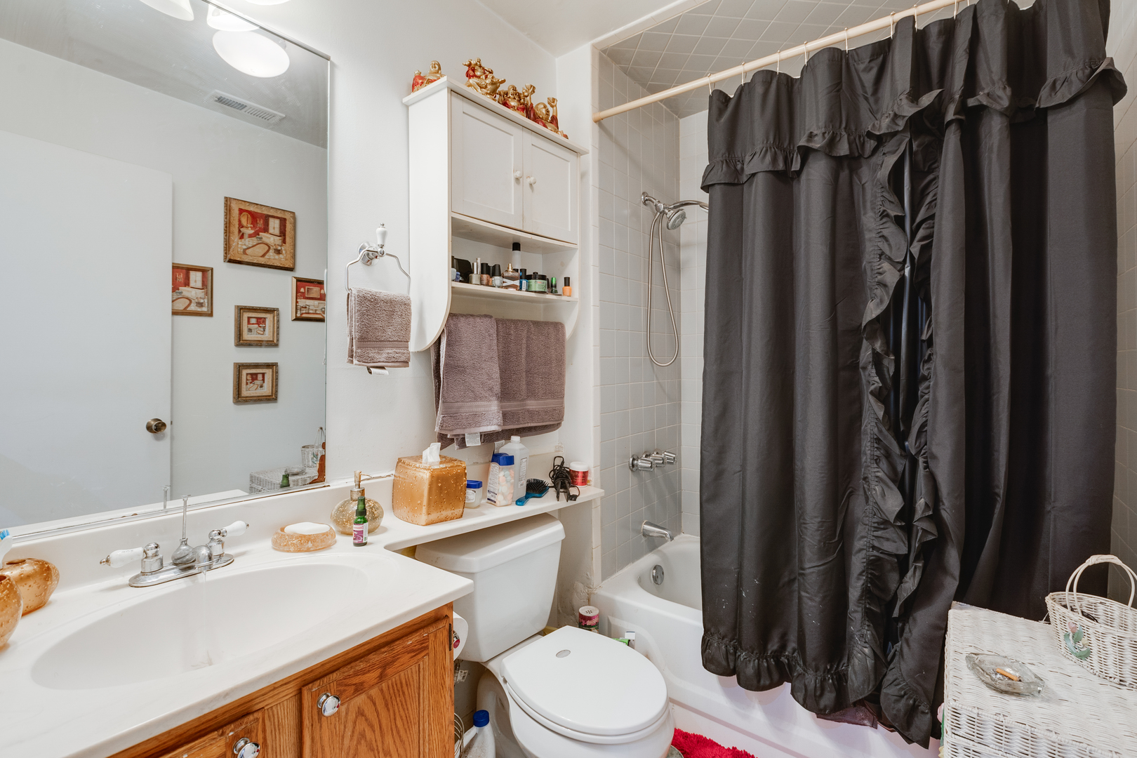 1005 South Racine Avenue Chicago, IL 60607 - Photo 13 of 16 a bathroom with a sink toilet vanity and shower