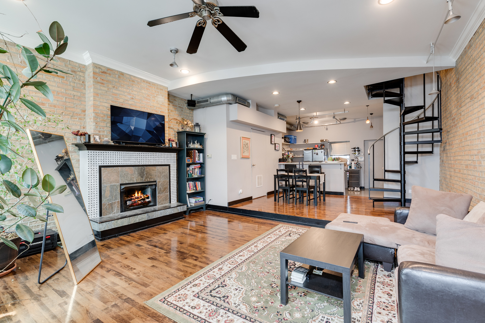 1005 South Racine Avenue Chicago, IL 60607 - Photo 3 of 16 a living room with furniture and a fireplace
