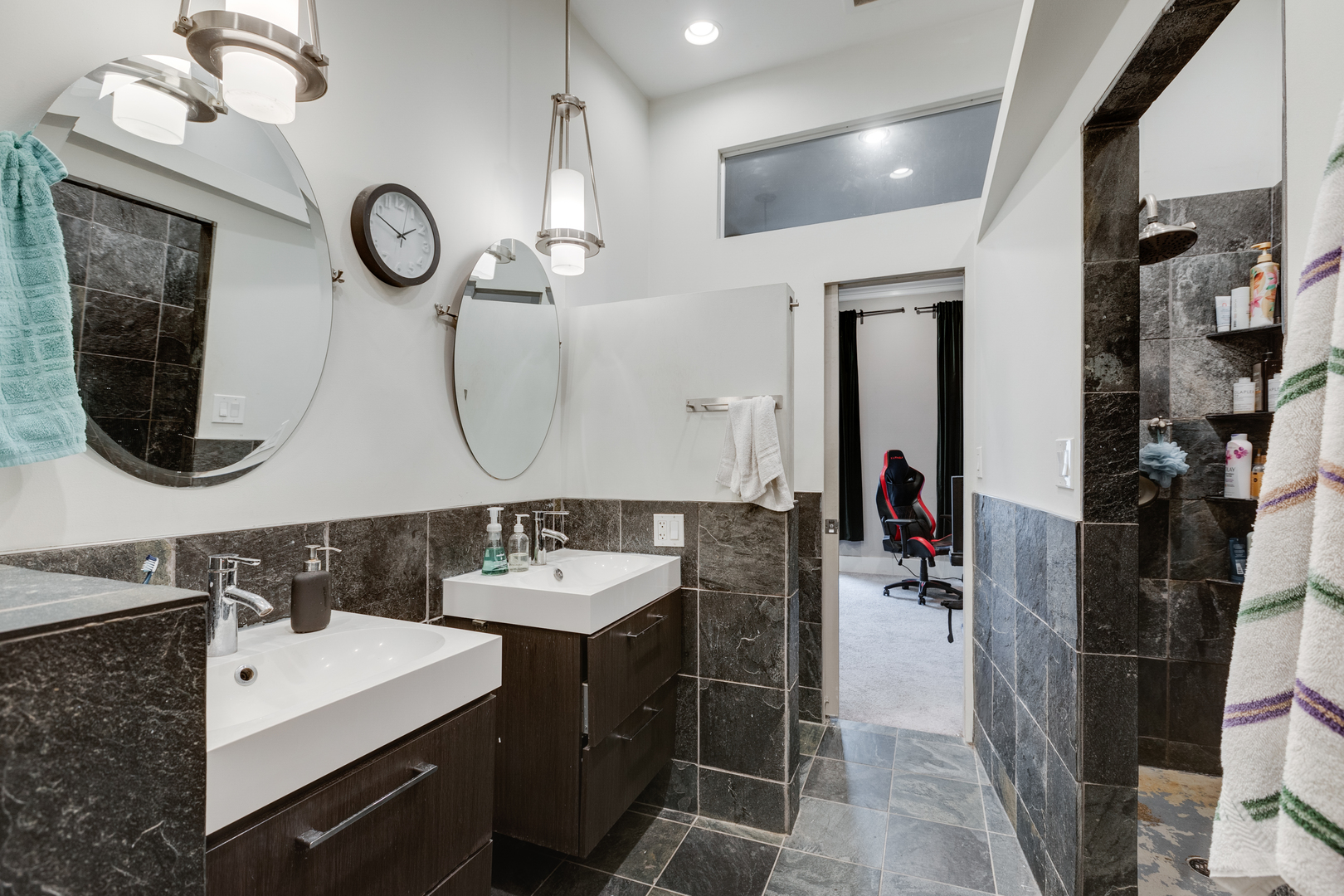 1005 South Racine Avenue Chicago, IL 60607 - Photo 9 of 16 a bathroom with a double vanity sink and a mirror
