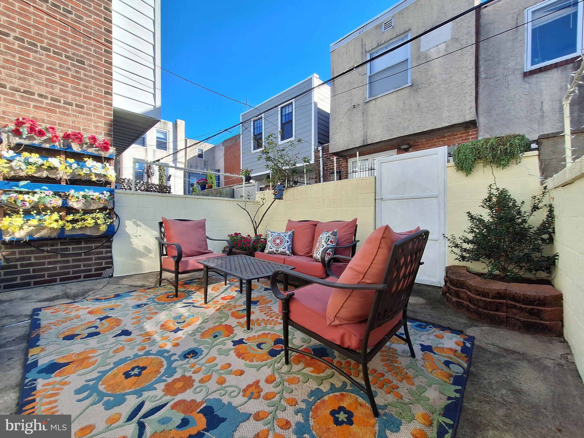 1006 Morris Street Philadelphia, PA 19148 - Photo 12 of 24 a group of chairs sitting in front of a building