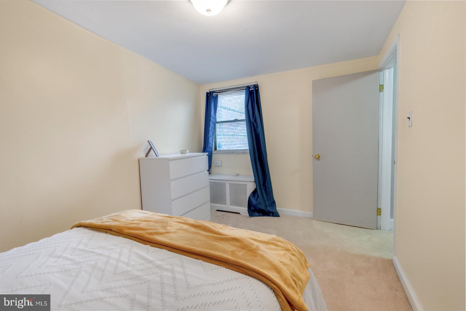 1006 Morris Street Philadelphia, PA 19148 - Photo 18 of 24 a bedroom with a bed and window