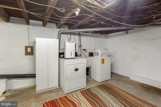 a utility room with cabinets
