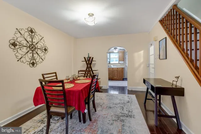 a view of a dining room with furniture and wooden floor
