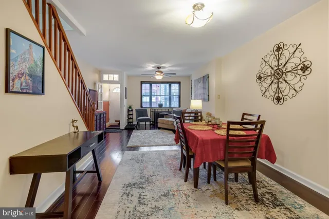 a view of a dining room with furniture window and wooden floor
