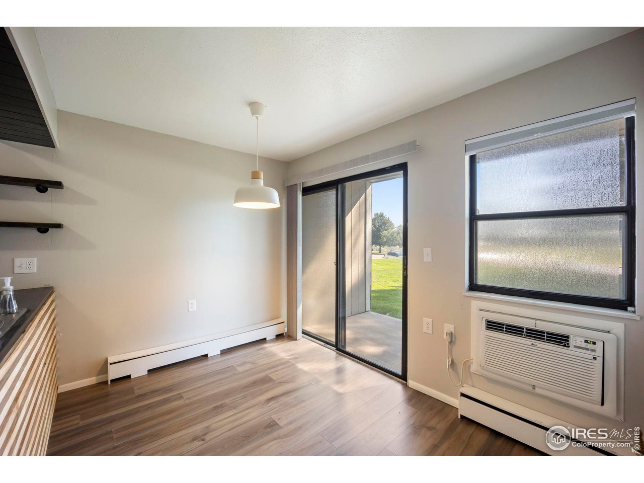 3431 Stover Street, Unit 513 Fort Collins, CO 80525 - Photo 13 of 28 a view of empty room with floor to ceiling window