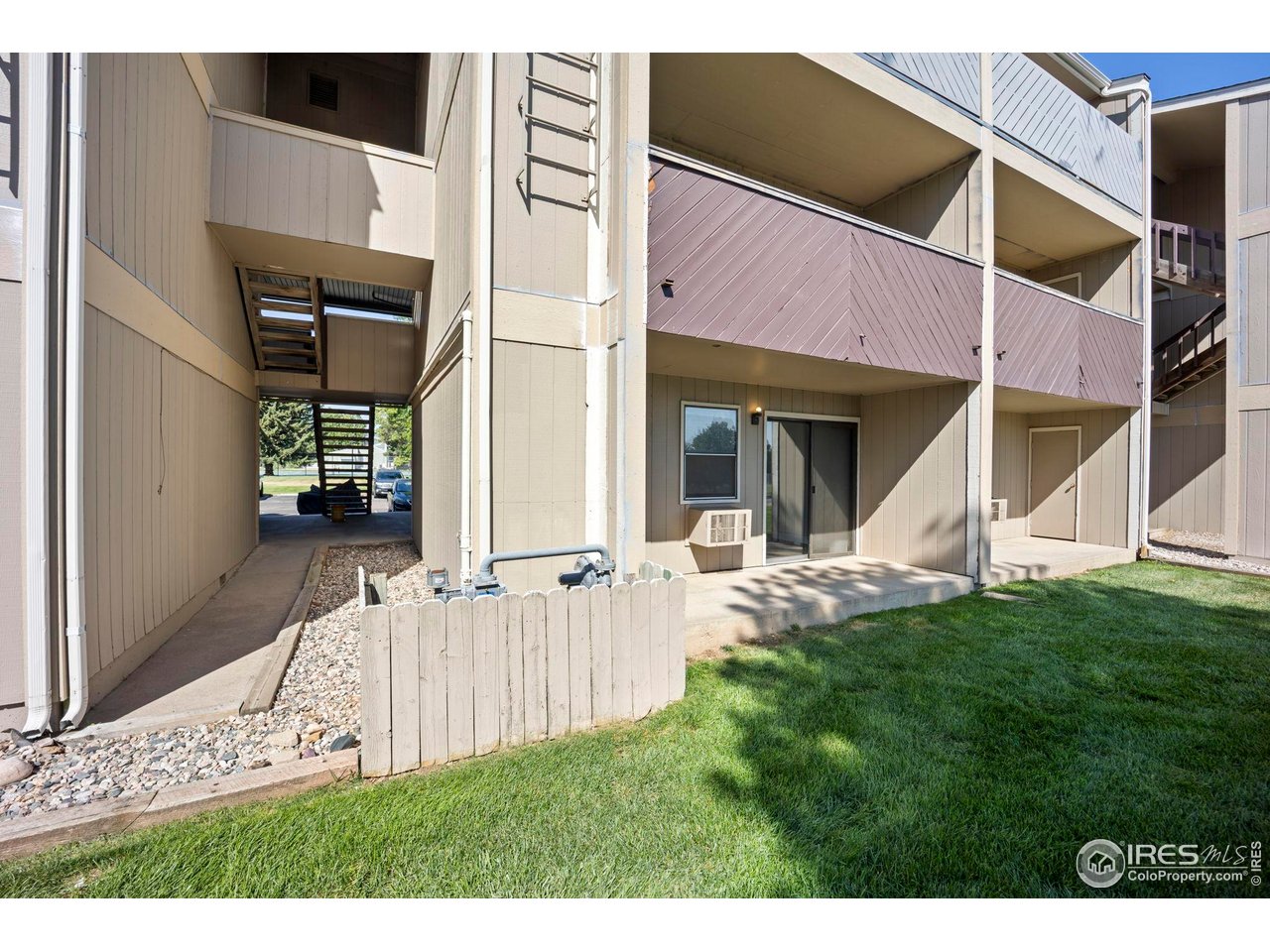 3431 Stover Street, Unit 513 Fort Collins, CO 80525 - Photo 20 of 28 a view of a house with a yard and sitting area