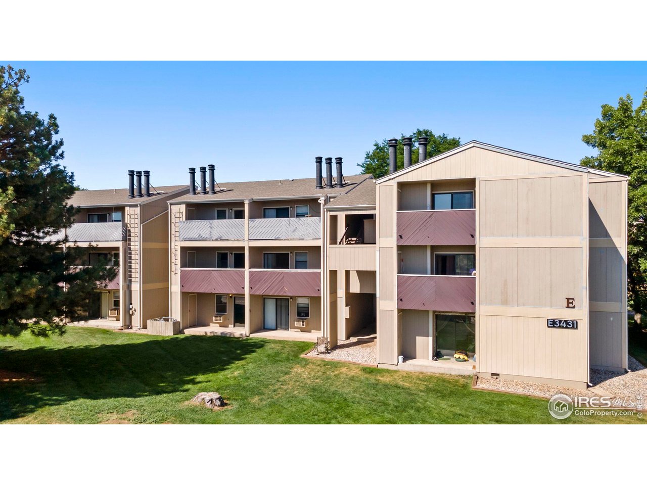 3431 Stover Street, Unit 513 Fort Collins, CO 80525 - Photo 3 of 28 a view of building with yard